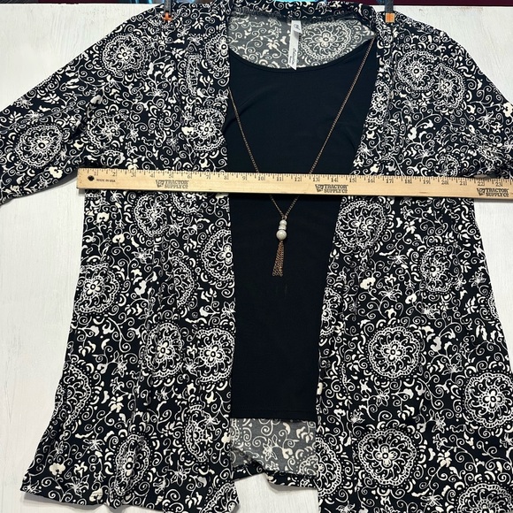 Elegant Black and White Blouse with Layered Design - Picture 4 of 11